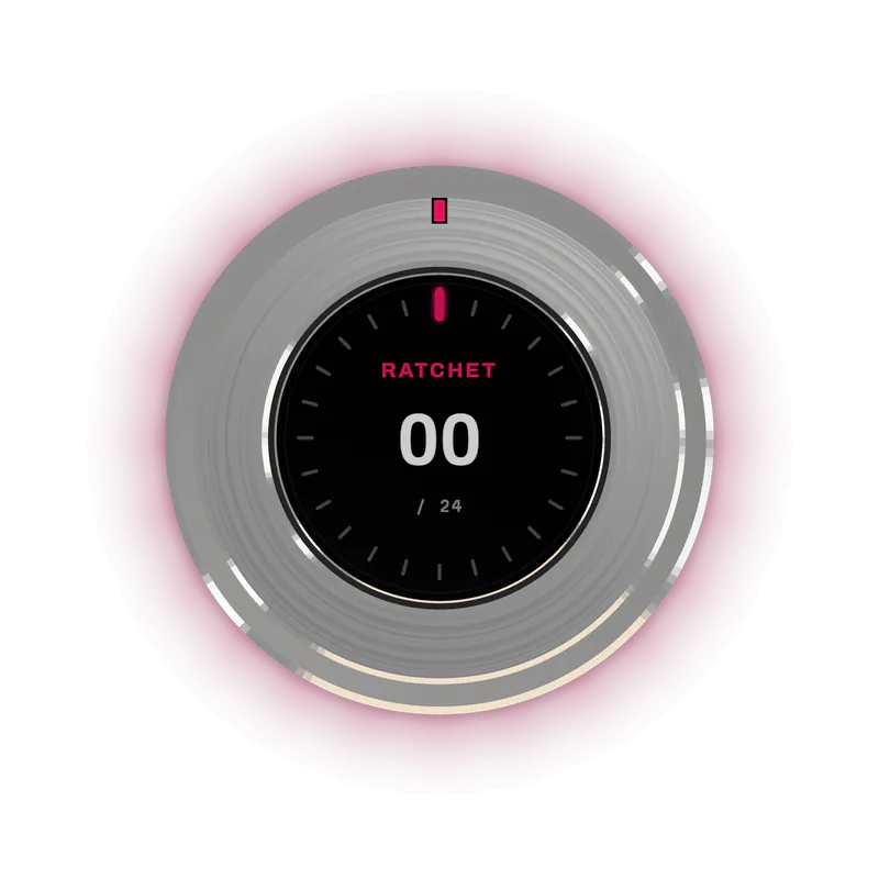 Detent One in Raw, seen from directly above, the round display showing the Ratchet feel